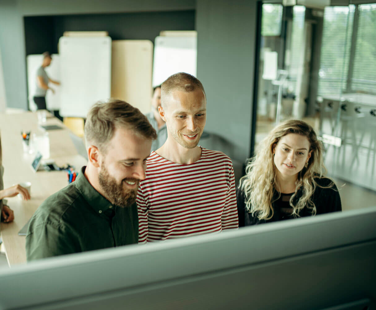 three Productboard team members collaborating